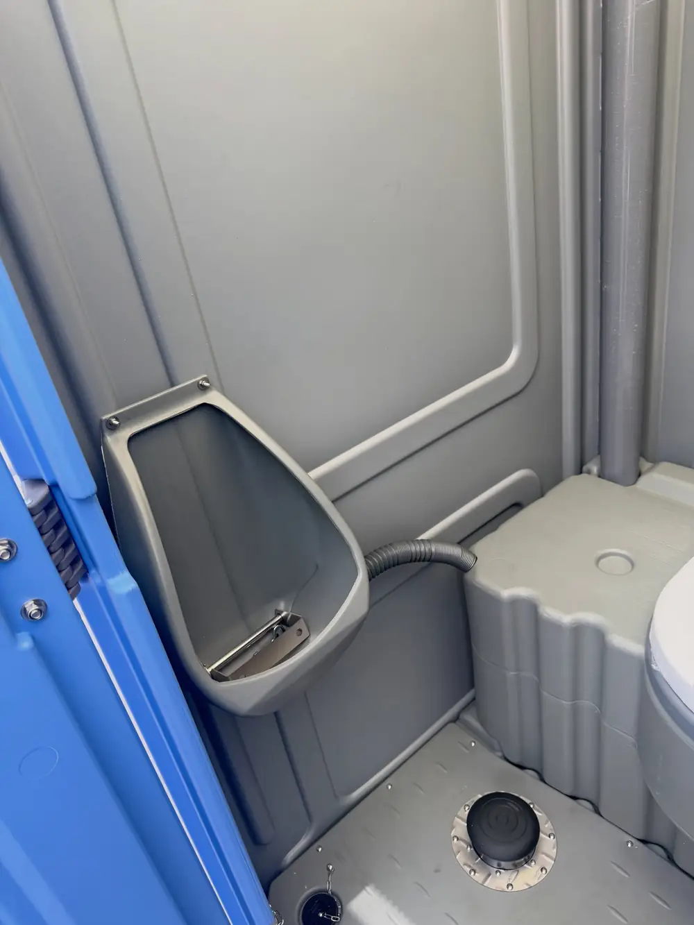 Urinal inside a standard portable toilet