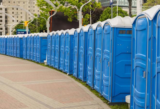 a row of portable restrooms at a fairground, offering visitors a clean and hassle-free experience in somersworth