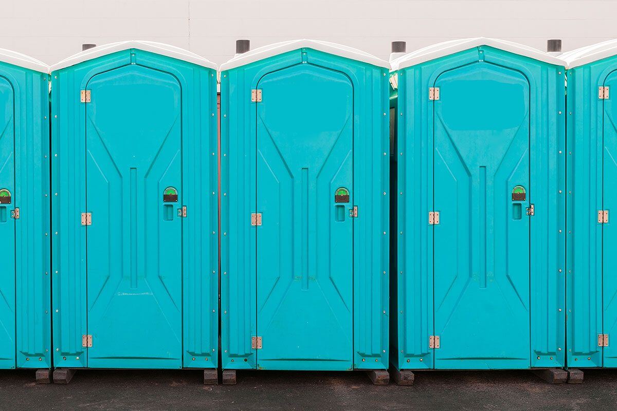 Industrial portable restroom units at a plant in Manchester, New Hampshire